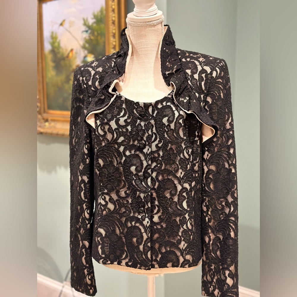 Tahari black lace jacket and satin trim with high-necked collar. Size is 12